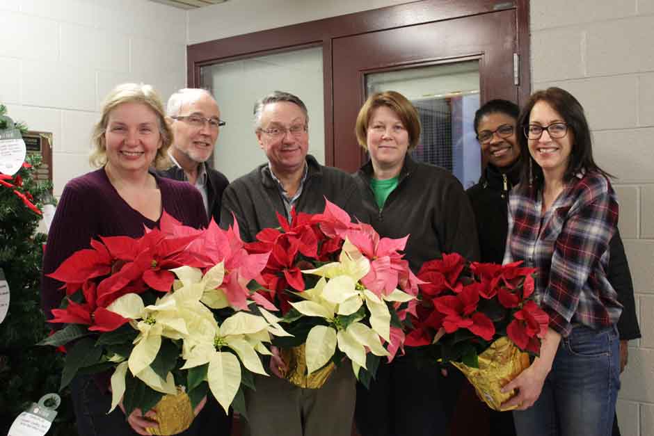 board members with poinsettias